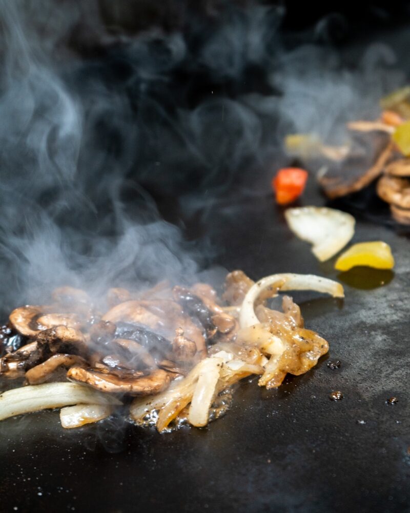 Authentic Philly cheesesteak sandwich with melted cheese and grilled onions