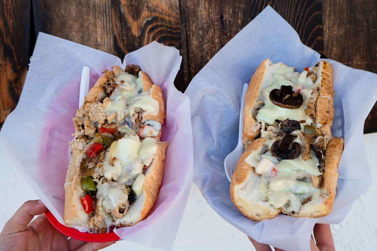 Cheesesteak catering sandwiches served on traditional hoagie rolls